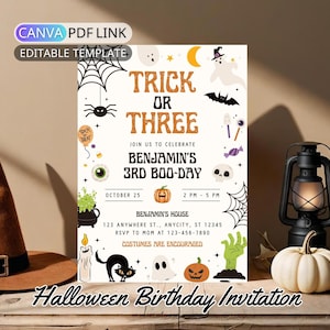 May include: Halloween birthday invitation with the text "Trick or Three" and "Benjamin's 3rd Boo-Day". The invitation includes Halloween-themed graphics like a spider, ghost, and pumpkin. A brown witch hat and a white pumpkin are also visible.
