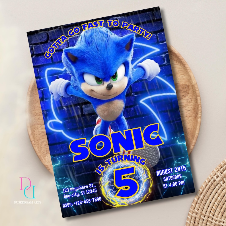 May include: A blue and yellow birthday invitation featuring Sonic the Hedgehog. The invitation says "Gotta Go Fast To Party!" and "Sonic Is Turning 5". The invitation also includes the date, time, and location of the party.