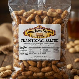 May include: A clear plastic bag filled with boiled peanuts, labeled "Bourbon Street Traditional Salted." The bag sits on a wooden surface, with scattered peanuts around it. The label includes nutrition facts.