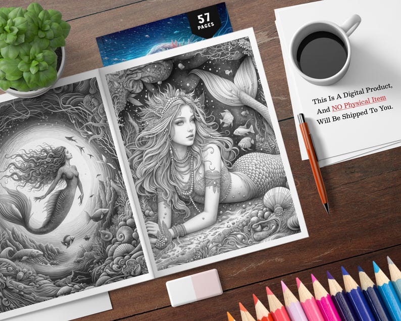 Puede incluir: Un libro para colorear en escala de grises abierto en dos p&aacute;ginas con ilustraciones de sirenas. Una sirena nada, la otra est&aacute; reclinada. El libro est&aacute; sobre una superficie de madera con l&aacute;pices de colores, una taza de caf&eacute; y una planta. El texto en un papel dice: "This Is A Digital Product, And NO Physical Item Will Be Shipped To You."