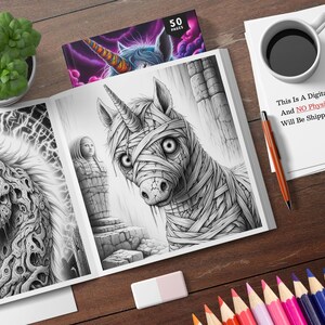 May include: A colouring book with 50 pages featuring a black and white illustration of a unicorn with bandages on its head and body. The unicorn is looking at the viewer. The book also features a black and white illustration of a creature with a skull-like head and a body made of intricate patterns. The text "This Is A Digital Product, And NO Physical Item Will Be Shipped To You." is printed on a white sheet of paper.