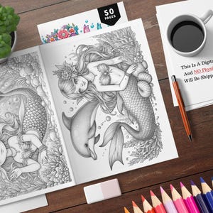 May include: A coloring book with 50 pages featuring two mermaids with long flowing hair and tails. The mermaids are surrounded by sea life, including a dolphin, seaweed, and seashells. The book is printed in black and white.