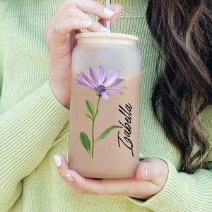 Glass jar girl holding cup for cold coffee