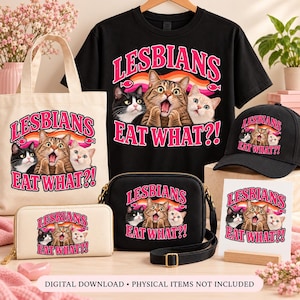 Black T-shirt, cream tote bag, black hat, cream wallet, black crossbody purse, and white postcard displaying three cats, pink “Lesbians Eat What?!” lettering, a pride ribbon, and fish accents.