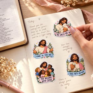 Jesus-themed journal
Prayer journal beside an open Bible, decorated with illustrated Jesus stickers showing a lamb, children, welcoming arms, and a daisy. A hand places a sticker.