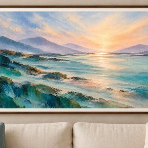 Teal and peach landscape with rugged foreground shapes, misty purple mountains, and a narrow band of golden light across the water.