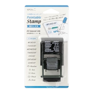 Puede incluir: Un sello negro y gris con 12 diseños diferentes, incluidos los días de la semana y los iconos del tiempo. El sello está etiquetado como "Paintable Stamp" y "Oil-based ink".