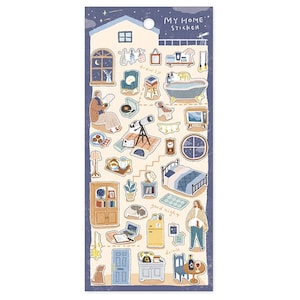 Op de afbeelding: Een stickervel met een blauwe achtergrond met diverse geïllustreerde elementen met een huisthema. Bevat een huisomtrek, meubels en de tekst "MY HOME STICKER". De illustraties zijn in zachte pastelkleuren.