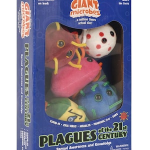 May include: A blue cardboard box containing five plush microbe toys. The box features the text Giant Microbes, Plagues of the 21st Century, COVID-19, Zika Virus, Measles, Pandemic Flu, and SARS. The plush toys are red, white with red spots, pink, blue, and green.