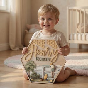 May include: A hexagonal wooden wall sign featuring a layered design with a honeycomb pattern at the top, the name Henry Robert in raised script and block lettering, and a scene depicting a character standing by a fence with a small bear figure.