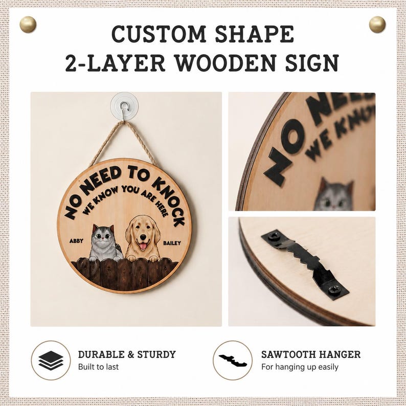 May include: A round two-layer wooden sign featuring the text NO NEED TO KNOCK WE KNOW YOU ARE HERE, with illustrations of a cat named Abby and a dog named Bailey behind a fence. The sign includes a jute rope for hanging and a black sawtooth hanger.