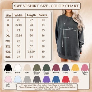 May include: A sweatshirt size and colour chart. Sizes range from S to 5XL, with width, length, and sleeve measurements in inches. Colour options include black, white, sand, military green, forest green, maroon, navy, gold, and safety pink.