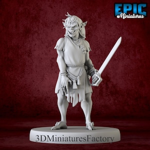 May include: A gray miniature figure of a fantasy character, holding a sword. The figure has pointed ears, a grimacing face, and is dressed in a tunic with a rope belt. The base of the figure reads "3D Miniatures Factory" and the logo "Epic Miniatures" is in the top right corner.
