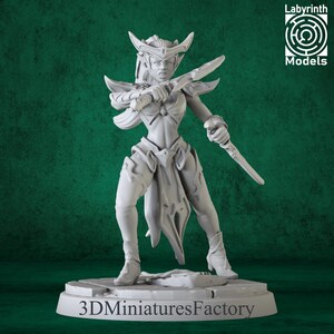 May include: A gray miniature figurine of a female warrior, holding a sword in a combat stance. The figure is wearing armor and a helmet with horns. The base of the figurine has the text "3D Miniatures Factory". The image also includes the text "Labyrinth Models".