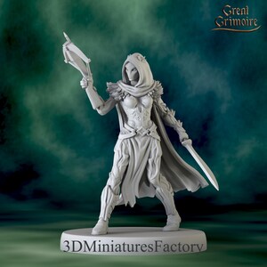 May include: A light gray resin miniature figure of a hooded warrior wearing textured armor and a cape. The figure holds a crossbow in the right hand and a sword in the left hand. The base features the text 3DMiniaturesFactory and Great Grimoire.
