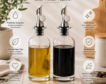 May include: Two clear glass oil and vinegar bottles with silver-colored pour spouts. The bottles are 21 cm tall, 8 cm in diameter, and have a 500 ml capacity. Text on the image includes "ÖL & ESSIG FLASCHEN" and various German descriptive labels.