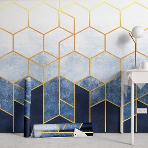 a room with a blue and gold wallpaper and a white table