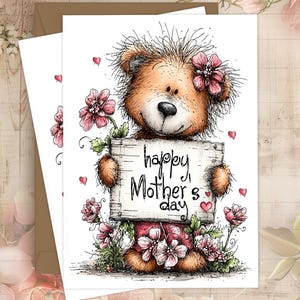 May include: A greeting card featuring a brown teddy bear holding a sign that reads "happy Mother's day." The bear is surrounded by pink flowers and hearts. The card is on a white background.