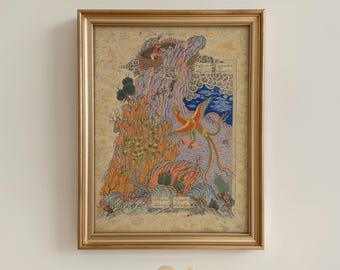 May include: A framed artwork featuring a vibrant illustration of a mythical bird with red, orange, and yellow plumage soaring above a mountain landscape. The artwork is set against a light beige background and framed in a gold-colored frame. The text "NOUR PRINTS" is at the bottom.