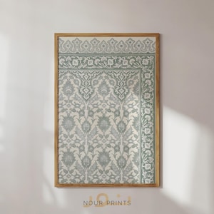 May include: A framed print of a traditional Islamic design with intricate floral patterns in shades of green and white. The design is reminiscent of a mosque or palace.