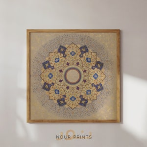 May include: A framed print of a detailed, intricate mandala design in shades of blue, gold, and red. The mandala is surrounded by a light beige background with a subtle pattern.
