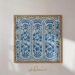 May include: A framed print with a blue and white floral pattern. The pattern features repeating arches with stylized flowers and leaves. The frame is made of wood and has a natural finish.