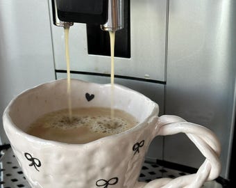 Handmade Ceramic Coffee Mug, Textured Bow Design, Twisted Handle