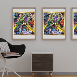 May include: Three framed abstract art prints with gold trim and a white border. The artwork features a colorful, geometric design with blues, greens, yellows, and oranges. A modern chair and a small nightstand are in the foreground.