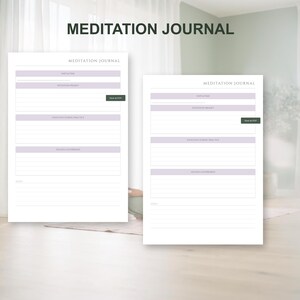 May include: Two white Meditation Journal pages with lavender and green accents. The text "MEDITATION JOURNAL" is at the top. The pages have sections for "Gratitude", "Intention", "Daily Focus", and "Reflections & Affirmations".