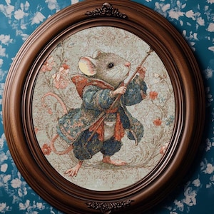 May include: A framed oval artwork depicts a mouse in a blue and red patterned outfit, holding a staff. The mouse is set against a floral background with a light blue and beige colour palette. The frame is a dark brown colour.