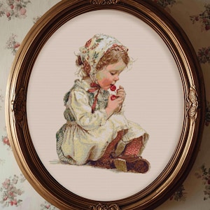 May include: An oval framed print of a young child seated and eating cherries. The child wears a bonnet and dress in soft colors. The frame is a warm gold tone, and the background is a floral wallpaper.