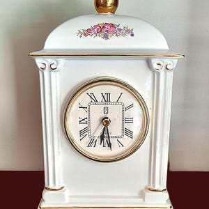 PS Limited Edition Mantel Clock. White ceramic/gold trim. Pillars. Pink/green floral. Gold knob. Battery. Vintage 1993