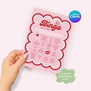 May include: A pink and red bingo card with the title "JGA Bingo" and the words "JGA Edition" in a pink heart. The card has a grid of 25 squares with various phrases related to a bachelorette party, such as "Someone gets engaged", "Someone cries", and "Someone spills a drink".