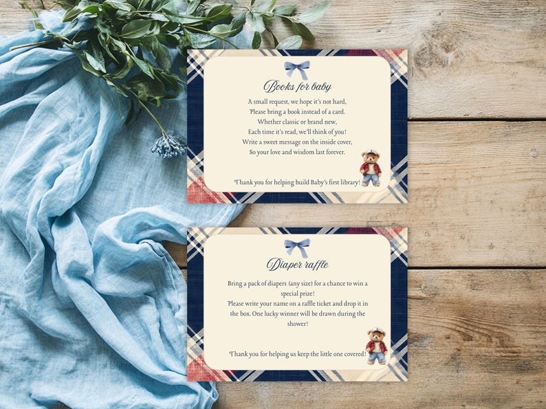 May include: Two cards with a blue and red tartan pattern. The top card says "Books for baby" and has a blue bow. The bottom card says "Diaper raffle" and has a blue bow. Both cards feature a cartoon bear wearing a red shirt and blue jeans.