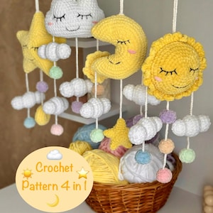May include: A crochet baby mobile featuring a yellow sun, moon, and star, and white clouds. The mobile is suspended from a white ceiling. A wicker basket filled with colourful yarn balls sits beneath the mobile. The text "Crochet Pattern 4 in 1" is displayed on a yellow circle with a sun, moon, and star.