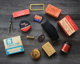 Vintage  lot office supplies junk collection brass compass stamp lock paper punch paper clips fasteners desktop flat lay prop metal tin