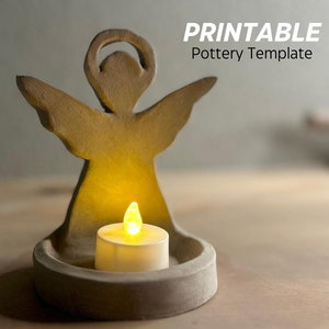 May include: Printable pottery template for an angel candle holder. The template shows a clay angel with a halo and outstretched wings holding a tea light candle in a small round base.