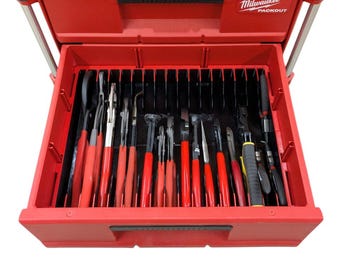 May include: A red Milwaukee Packout toolbox with a drawer open, revealing a variety of pliers organized in a black foam insert.