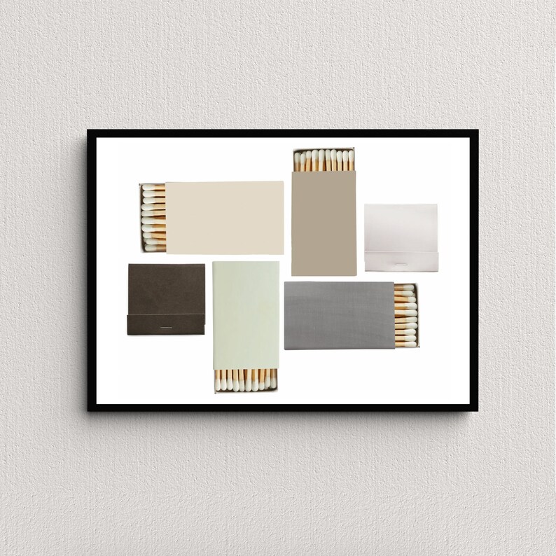 May include: A set of six matchboxes with different colored labels. The matchboxes are arranged in a geometric pattern on a white background.