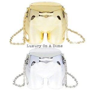 Novedad, bolso convertible con forma de tope, bolso de mano tipo bandolera, bolso de hombro metálico dorado/plateado, maniquí inferior, moda artística