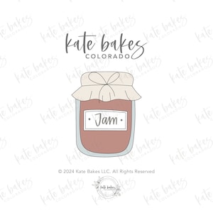 May include: A hand-drawn illustration of a glass jar with a white lid and a label that says "Jam". The jar is filled with a pink substance. The image is surrounded by the text "Kate Bakes Colorado" in a handwritten font.