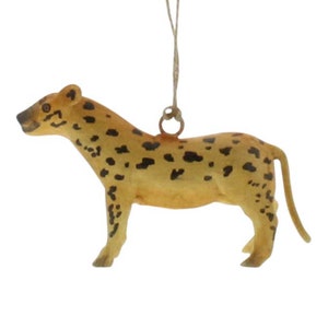 May include: A brown and black spotted cheetah ornament with a string for hanging.