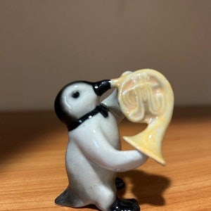 Hand-Painted Miniature Porcelain Penguin Playing French Horn 28425