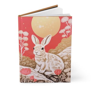 Carnet de notes à couverture rigide avec une illustration élégante de lapin et de lièvre