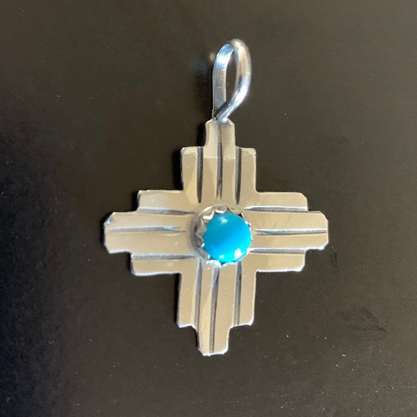 Navajo-Crafted Zia Sun Symbol Pendant in Sterling Silver with Turquoise Cabochon