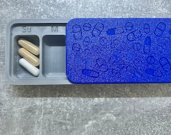 Pill and vitamin organiser with decorative lid
