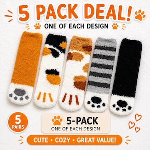 May include: A five-pack of fuzzy socks featuring cat paw designs. The set includes one solid orange, one white with black and orange patches, one white with brown and orange spots, one gray striped, and one solid black pair, all with paw pad details.