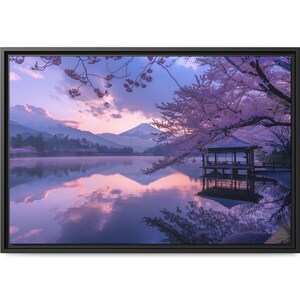 May include: A scenic landscape photograph featuring a lake with a wooden gazebo in the foreground. The lake is surrounded by mountains and trees, and the sky is a soft pink and purple. The image is taken at sunrise, and the reflection of the sky and mountains can be seen in the water.