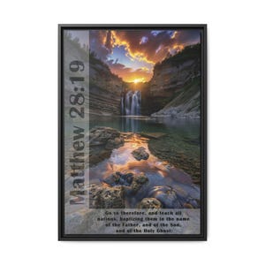 May include: A framed print with a scenic landscape photograph of a waterfall in a canyon with a sunset sky. The print includes the text "Matthew 28:19" and a bible verse about teaching all nations.