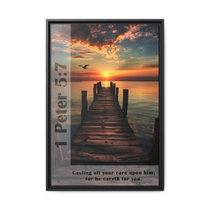 May include: A framed print with a sunset over a wooden pier extending into the water. The print features the Bible verse "1 Peter 5:7 Casting all your care upon him; for he careth for you."